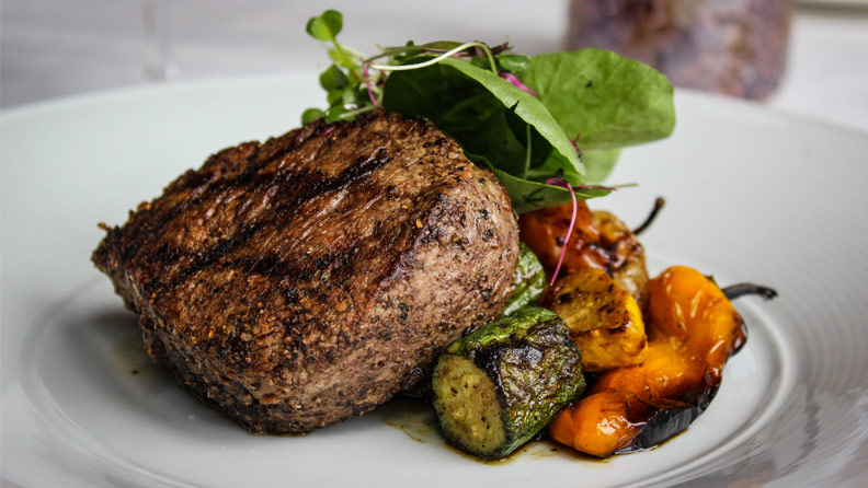 filet with grilled vegetables and arugula